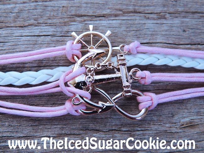 Pink and white leather bracelets with anchor and infinity sign and ship steering wheel by The Iced Sugar Cookie. www.Theicedsugarcookie.com